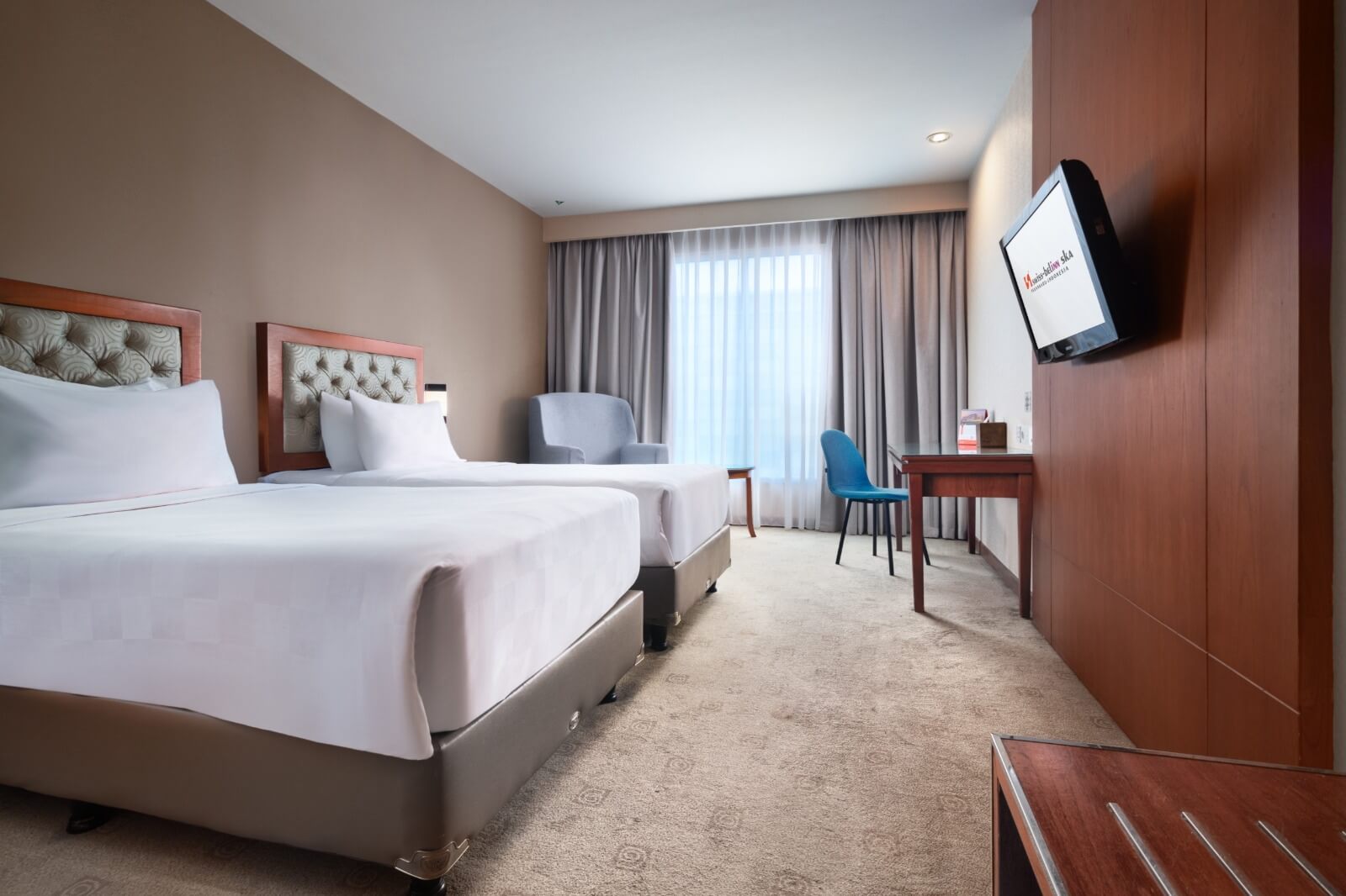 Kamar Deluxe di Swiss-Belinn SKA Pekanbaru dengan fasilitas lengkap dan suasana nyaman.