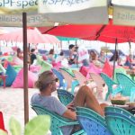 Pengunjung menikmati suasana senja di Pantai Seminyak, Bali.