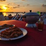 Menikmati seafood dan pemandangan sunset di Pantai Kedonganan, Jimbaran.
