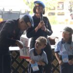 Kunjungan edukasi Sekolah Nava Dhammasekha Guang Ming Bali ke Mako Satbrimob Polda Bali.